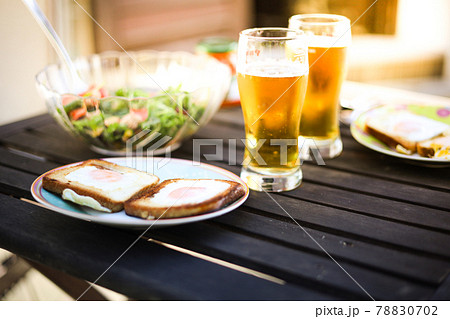 Outdoor lunch with beer, scrambled eggs. Outdoor lunch with beer, scrambled eggs. 78830702