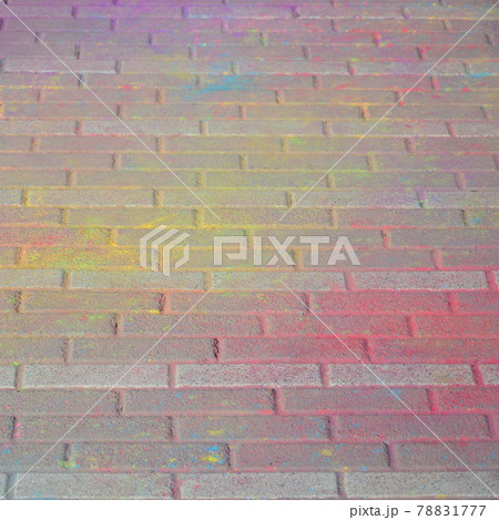 Multi colored paving slabs, powder coated with dry colors at the Holi festival Multi colored paving slabs, powder coated with dry colors at the Holi festival 78831777