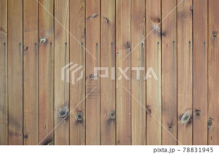 Close up of brown wooden fence panels. Many vertical wooden planks 78831945