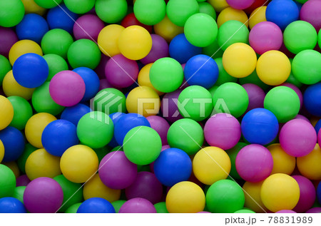 Swimming pool for fun and jumping in colored plastic balls 78831989