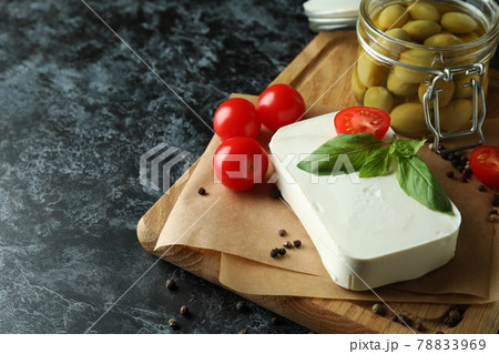 Concept of tasty food with feta cheese on black smokey background 78833969