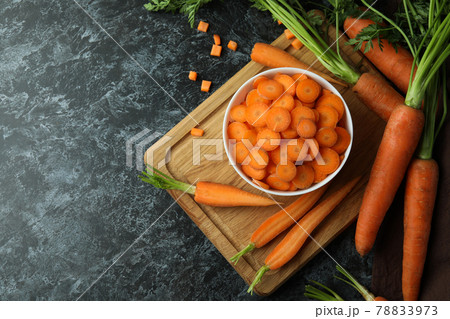 Concept of fresh vegetable with carrot on black smokey table Concept of fresh vegetable with carrot on black smokey table 78833973
