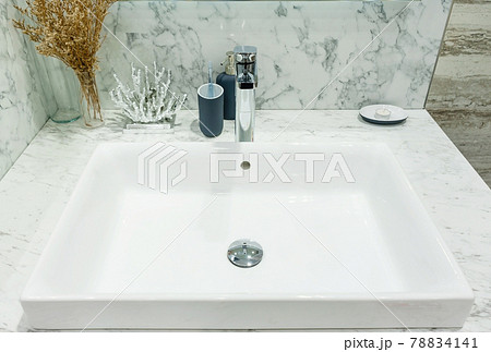 Interior of bathroom with sink basin faucet and mirror. Modern design of bathroom Interior of bathroom with sink basin faucet and mirror. Modern design of bathroom 78834141