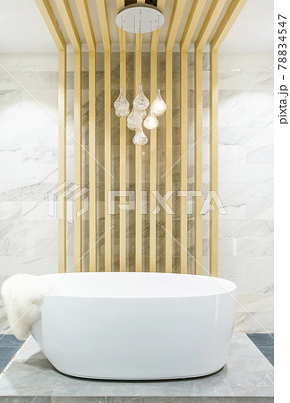 Modern bathroom interior with minimalistic shower and lighting, white toilet, sink and bathtub 78834547