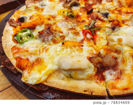 Close up cheese pizza on wooden pan for appetizer dish meal Close up cheese pizza on wooden pan for appetizer dish meal 78834609