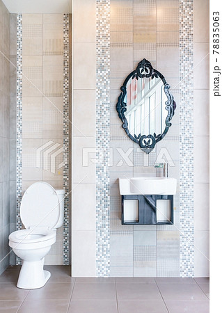 Modern bathroom interior with modern countertop basin, toilet and mirror 78835063