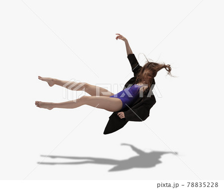 Flying. Young beautiful girl, female ballet dancer dancing isolated over white background with shadow. 78835228
