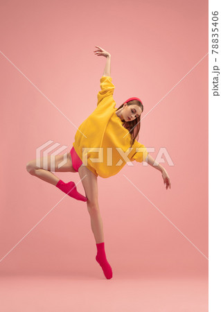 Slim tender young beautiful girl, female ballet dancer dancing isolated over pink background. Slim tender young beautiful girl, female ballet dancer dancing isolated over pink background. 78835406