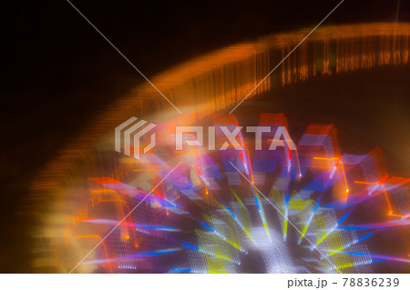 Ride in motion at the amusement park, night illumination. Long exposure 78836239