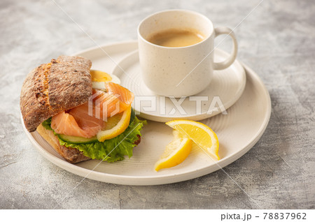 Sandwiches with smoked salmon, salad, cucumbers and eggs. Sandwiches with smoked salmon, salad, cucumbers and eggs. 78837962