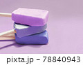 bluberry, grape and acai popsicles on purple background with copy space 78840943