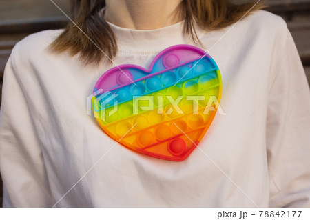 Woman using pop it fidget toy closeup. 78842177