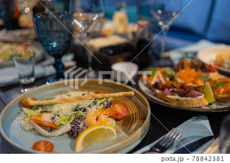 delicious dishes on the table in the restaurant. serving table. sharpness in the middle of the table. delicious dishes on the table in the restaurant. serving table. sharpness in the middle of the table. 78842381