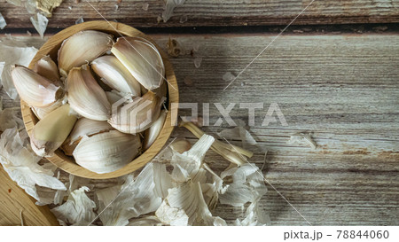 The garlic on wood table for food or cooking concept. The garlic on wood table for food or cooking concept. 78844060
