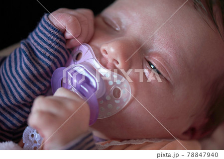 One month newborn baby sleeping in bed One month newborn baby sleeping in bed 78847940