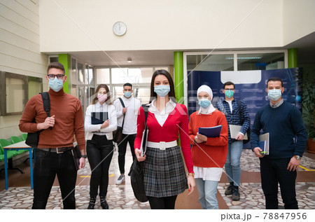 students group at university walking and wearing face mask 78847956