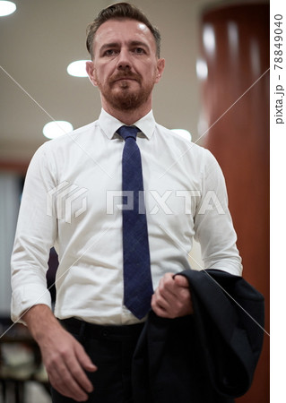 corporate business man portrait at luxury office 78849040
