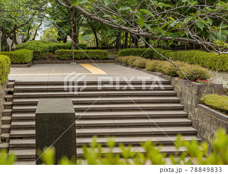 Stone staircase, leading up and into a park. 78849833