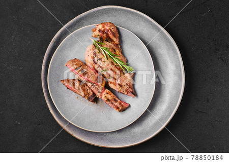 Overhead view of ribeye steak on a plate 78850184