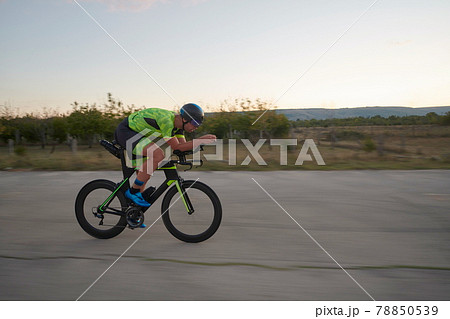 triathlon athlete riding a bike triathlon athlete riding a bike 78850539