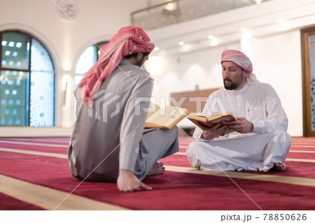 two muslim people in mosque reading quran together concept of islamic education two muslim people in mosque reading quran together concept of islamic education 78850626