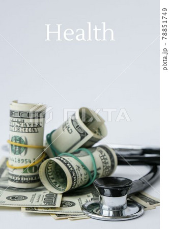 Stack of cash dollars and stethoscope. The concept of medical expensive medicine, doctors salary. Copy space for text. Health Life insurance. vaccination costs. Covid-19 crimes 78851749