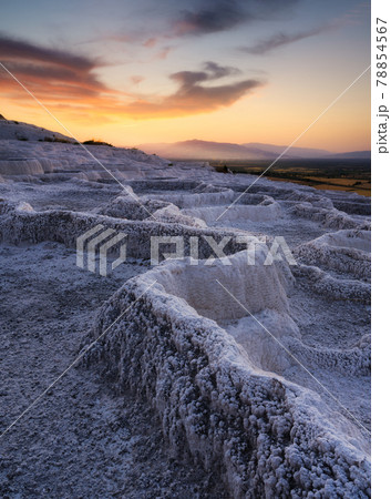 Summer landscape during sunset. The view of the travertines and the bright sunset. 78854567
