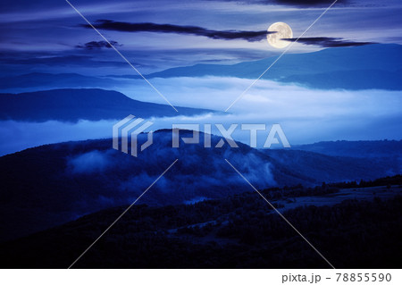 glowing fog in the rural valley at night. beautiful mountain landscape in full moon light. view from the hill 78855590