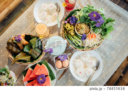 A set of traditional Thai food, dessert, drink, and fresh seasonal fruits. 78855638