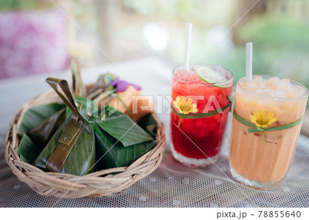 Thai drinks with traditional dessert of steamed sticky rice. 78855640