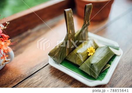 Steamed sticky rice with banana, Thai street food. 78855641