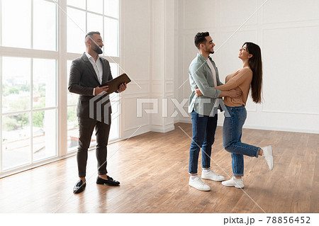 Excited Couple Buying New Apartment, Celebrating Successful Deal Excited Couple Buying New Apartment, Celebrating Successful Deal 78856452