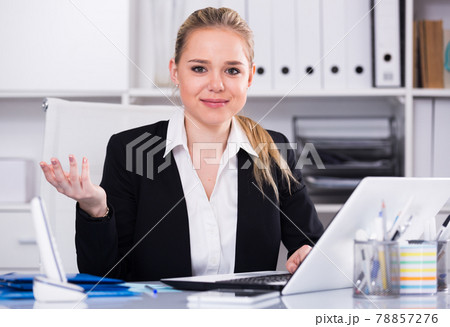 Businesswoman using laptop 78857276