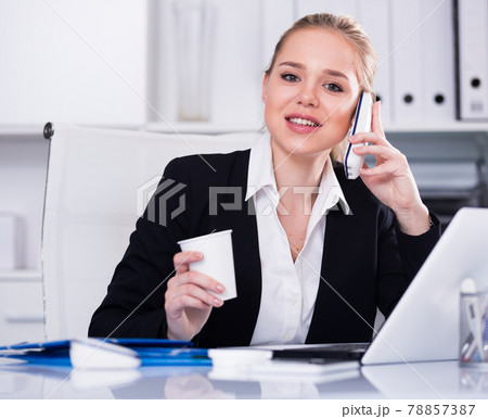 Businesswoman having phone conversation Businesswoman having phone conversation 78857387