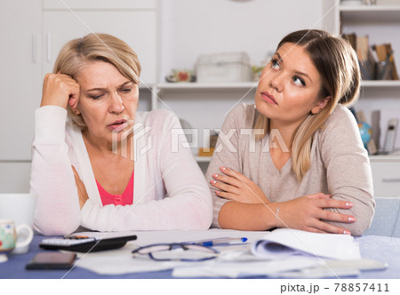 mother and her adult daughter with financial problems mother and her adult daughter with financial problems 78857411