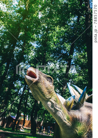 Kentrosaurus in a natural environment. Dinosaur with a beak and spines on its back. Robotics and animatronics. Reconstruction of extinct animals from the prehistoric period Kentrosaurus in a natural environment. Dinosaur with a beak and spines on its back. Robotics and animatronics. Reconstruction of extinct animals from the prehistoric period 78857570