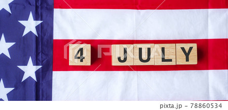 Fourth of July text on United States of America flag background. USA holiday of Independence and celebration concepts Fourth of July text on United States of America flag background. USA holiday of Independence and celebration concepts 78860534