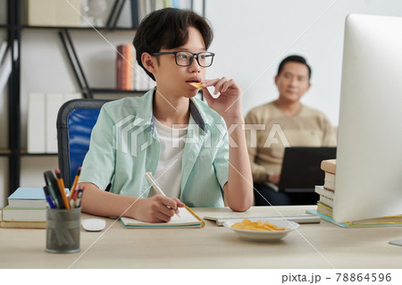 Teenage Boy Watching Lection on Computer Teenage Boy Watching Lection on Computer 78864596