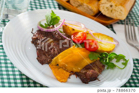 Well done roasted beef steak with cheese Well done roasted beef steak with cheese 78866370