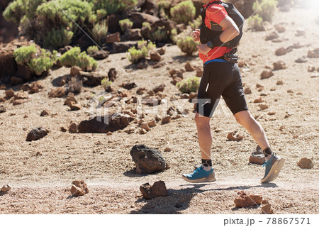 Male athlete run mountain race wth hydratation trail vest for running Male athlete run mountain race wth hydratation trail vest for running 78867571