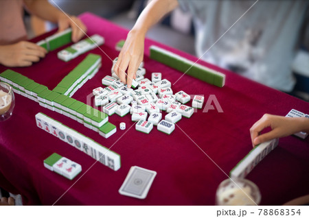 People playing mahjong traditional Chinese board game 78868354