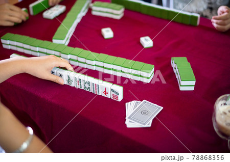 People playing mahjong traditional Chinese board game People playing mahjong traditional Chinese board game 78868356