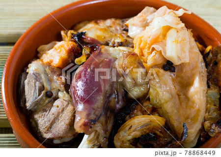 Traditional Norwegian Farikal - stewed mutton meat with cabbage and peppercorns served in clay dishware Traditional Norwegian Farikal - stewed mutton meat with cabbage and peppercorns served in clay dishware 78868449