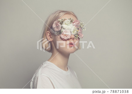 Young girl with closed eyes and roses flowers on white background Young girl with closed eyes and roses flowers on white background 78871038