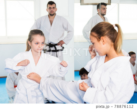 Girls training during karate class Girls training during karate class 78876112
