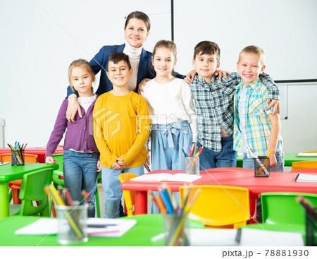 Teacher and happy children in classroom Teacher and happy children in classroom 78881930