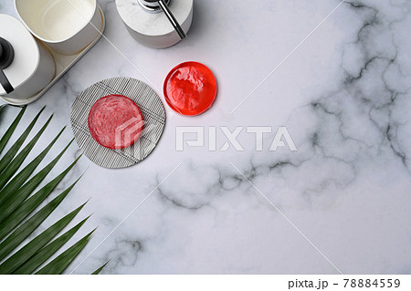 Handmade organic soap and shampoo bottle on marble background. Handmade organic soap and shampoo bottle on marble background. 78884559