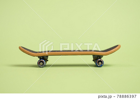Fingerboard on a green background in the center. Fingerboard on a green background in the center. 78886397