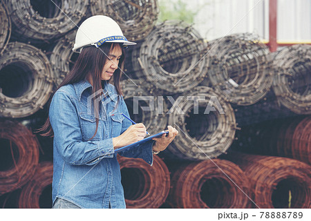 Woman construction engineer wear safety white hard hat at construction site industry worker. Female engineer worker civil engineering with hard hat safety helmet. Woman construction Engineer concept 78888789