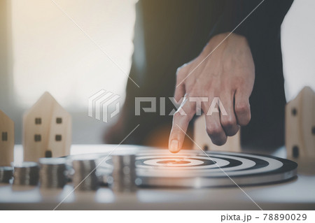 Targeting the new business concept, Businessman use fingers touch dart to virtual target dart board,Executive marketing, investment goal and target for business investment. 78890029